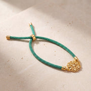 Snowflake Thread Bracelet on travertine