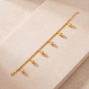 Sphere Charm Bracelet (D1) on travertine