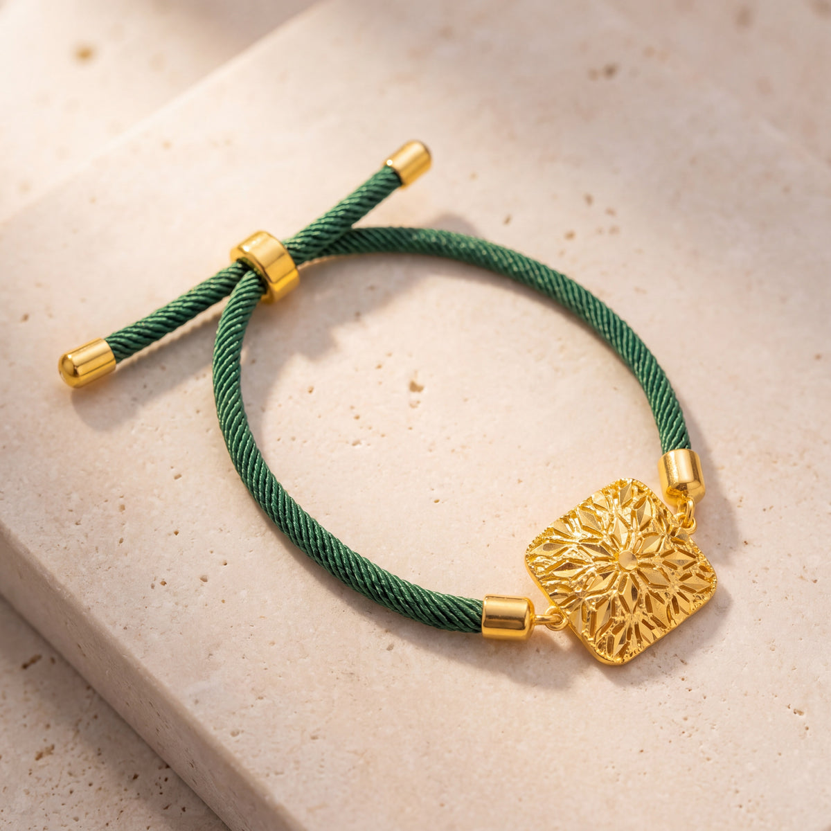 Square Floral Thread Bracelet on travertine