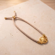 Sunburst Thread Bracelet on travertine