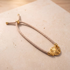 Sunburst Thread Bracelet on travertine