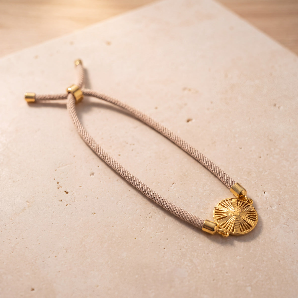 Sunburst Thread Bracelet on travertine