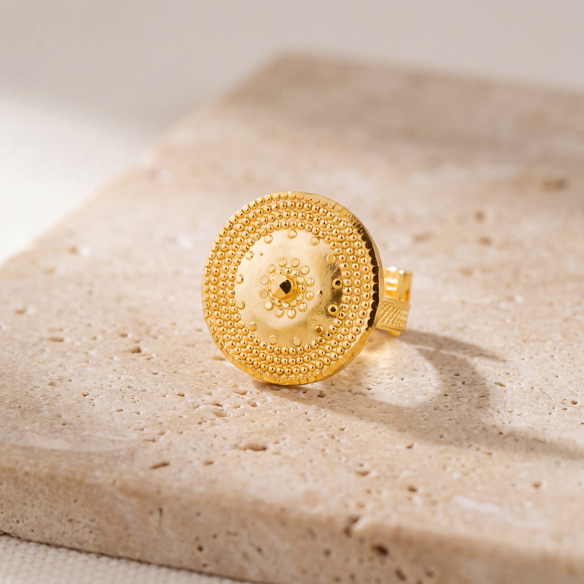Traditional Ring (146) on travertine