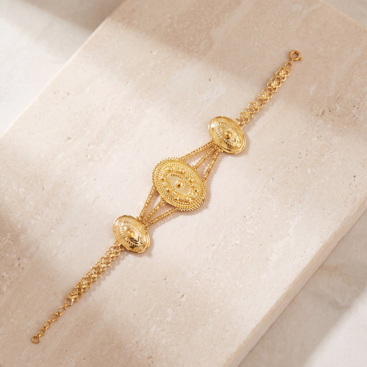Traditional Stamp Bracelet (D6) on travertine
