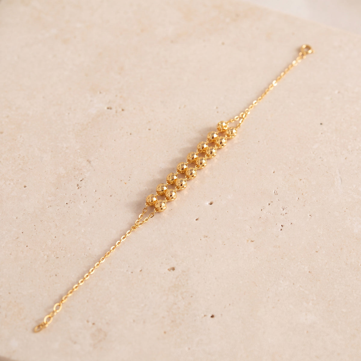 Twin Orb Bracelet (D1) on travertine