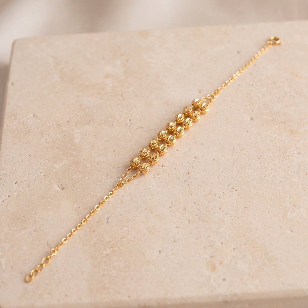 Twin Orb Bracelet (D2) on travertine