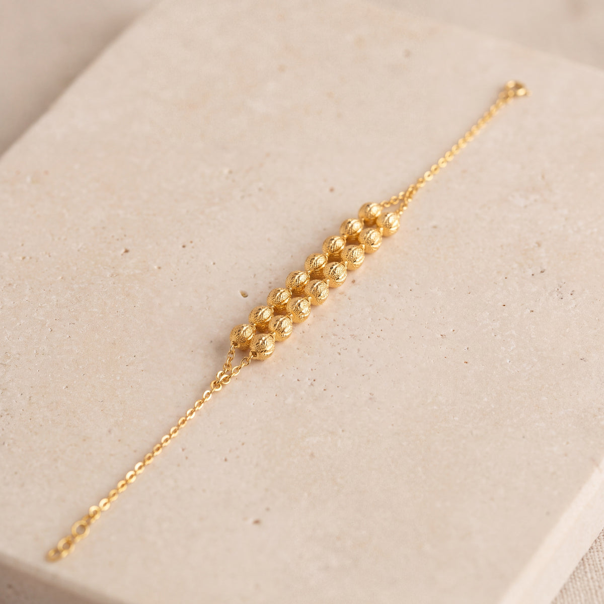 Twin Orb Bracelet (D3) on travertine