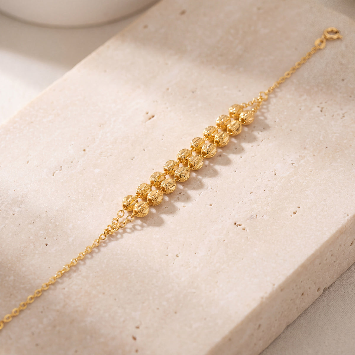 Twin Orb Bracelet (D4) on travertine