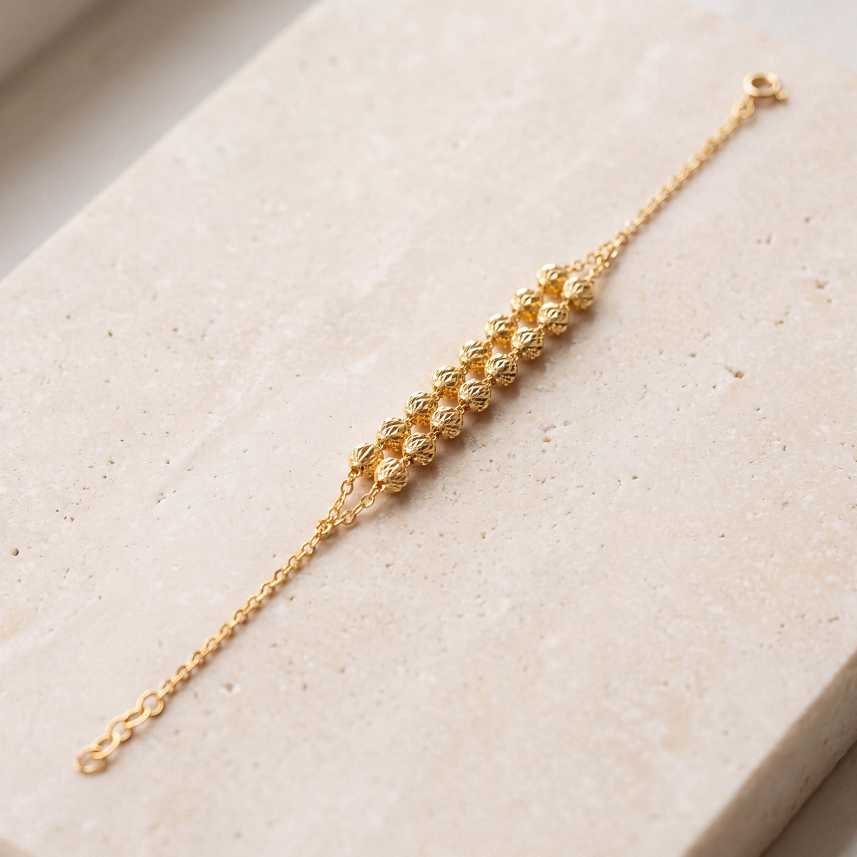 Twin Orb Bracelet (D7) on travertine