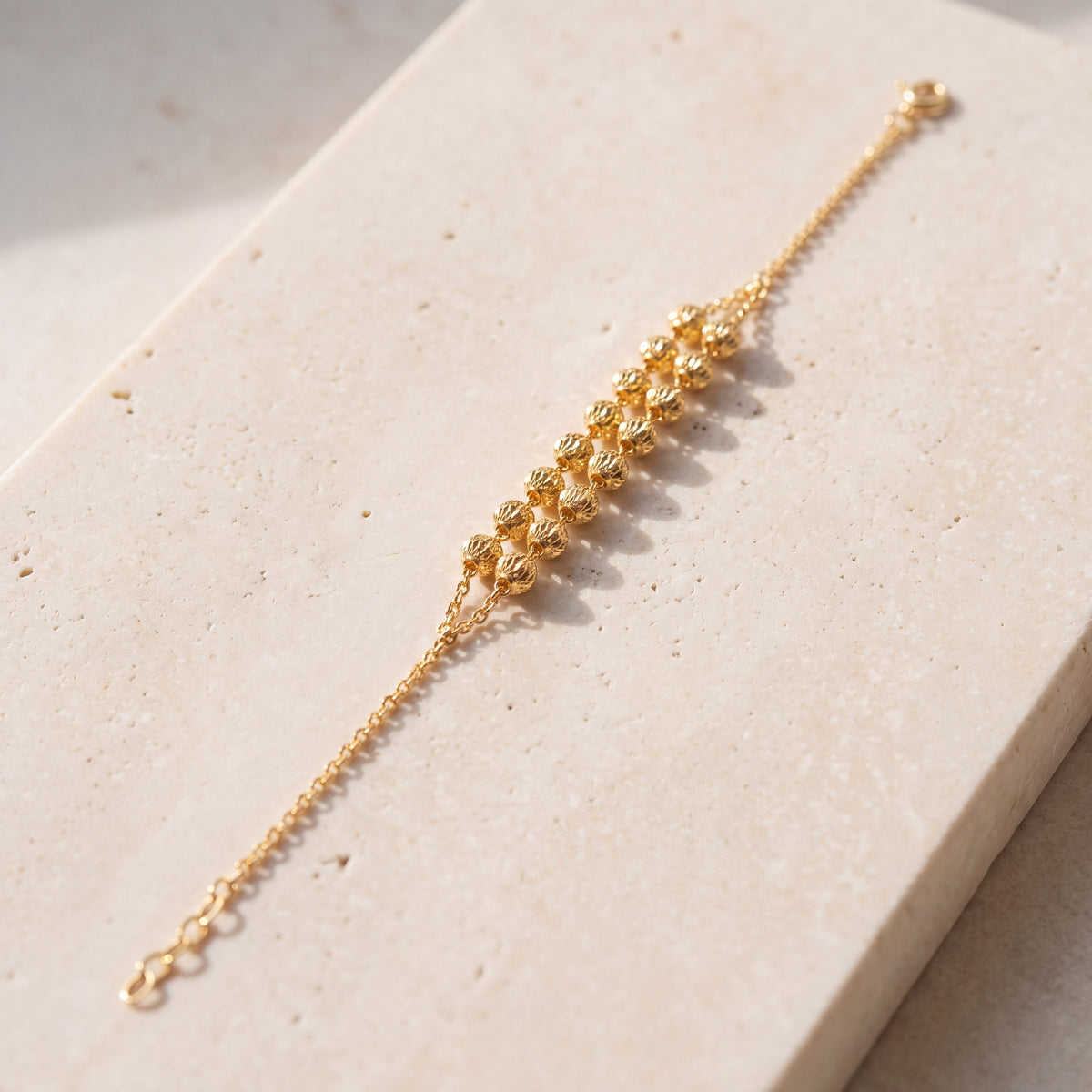 Twin Orb Bracelet (D8) on travertine