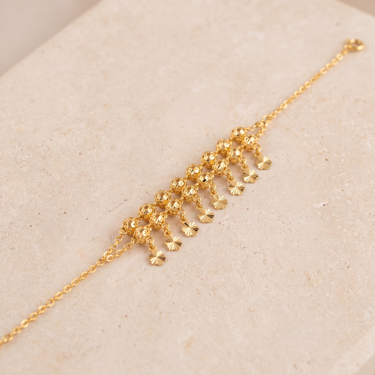 Twin Orb Fringe Bracelet (D1) on travertine