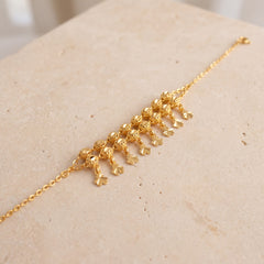 Twin Orb Fringe Bracelet (D2) on travertine