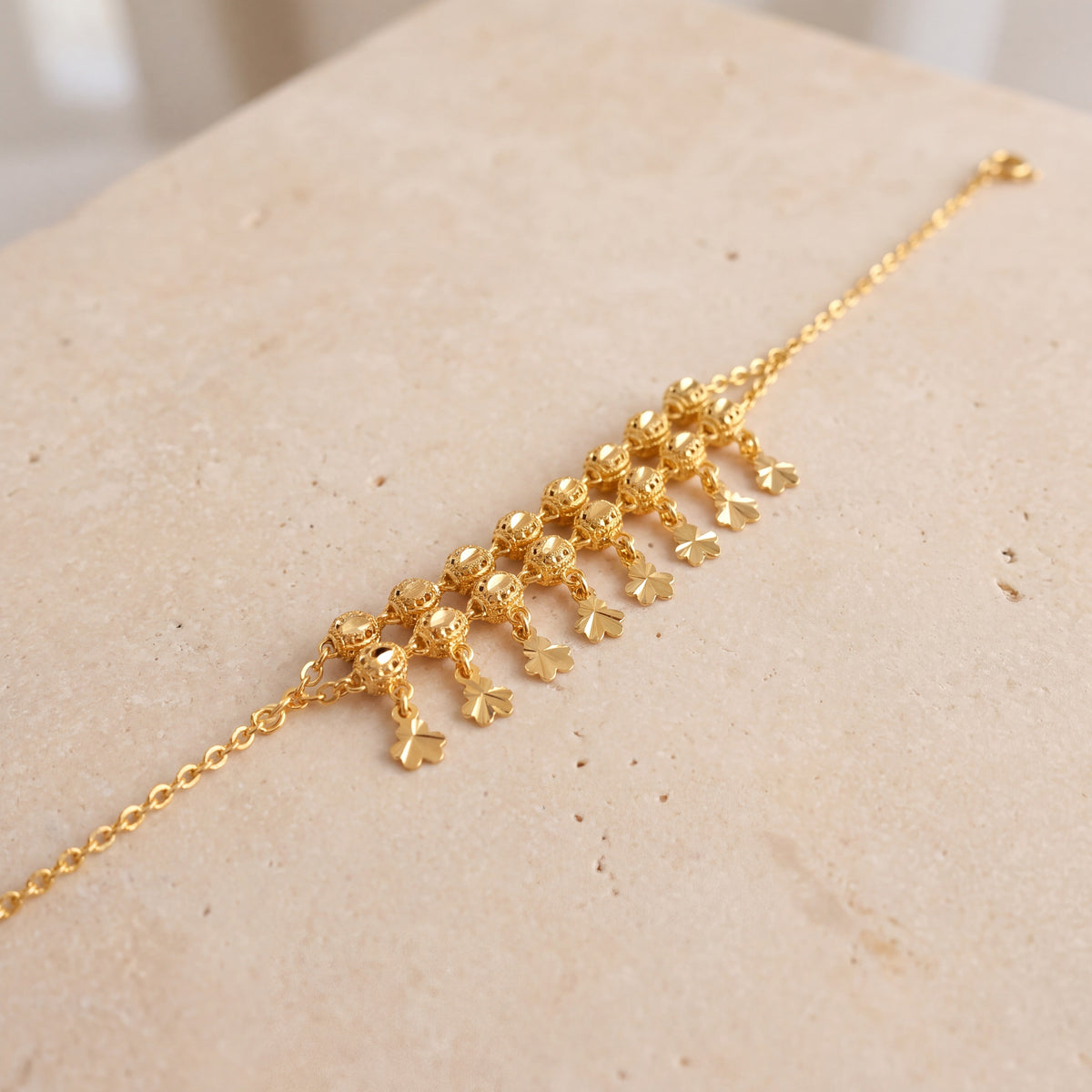 Twin Orb Fringe Bracelet (D2) on travertine