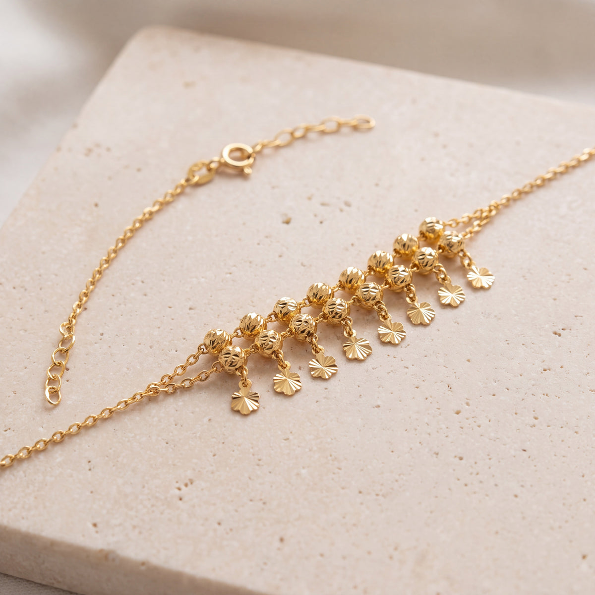 Twin Orb Fringe Bracelet (D6) on travertine