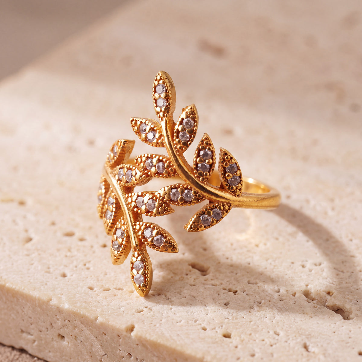 Zircon Leaf Ring (D1) on travertine